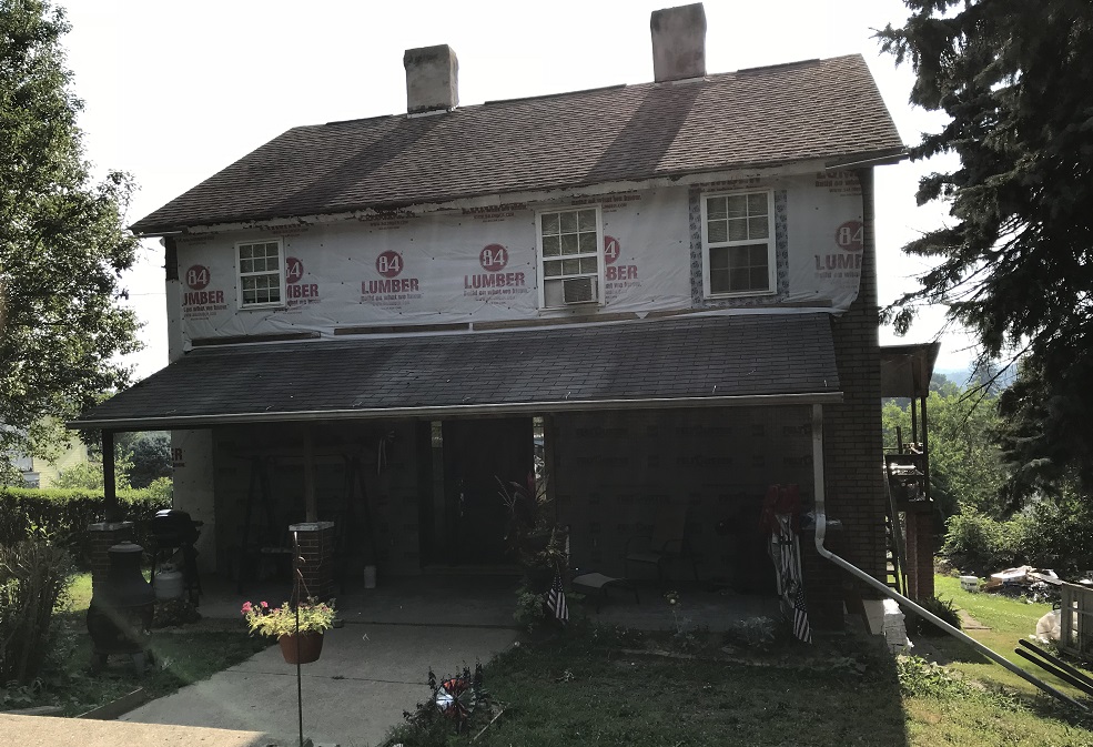 Porch roof remodel project with siding and wrap     