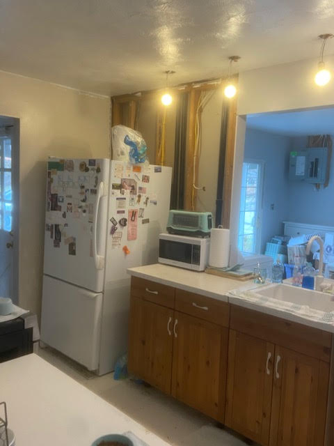 Kitchen wall repairs with new drywall finish