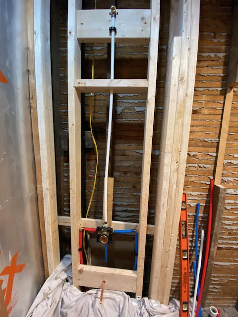 Acrylic tub/shower combo with fresh plumbing.    