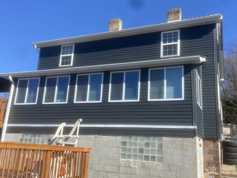 Total transformation! Install vinyl siding, fascia, trim and gutters.