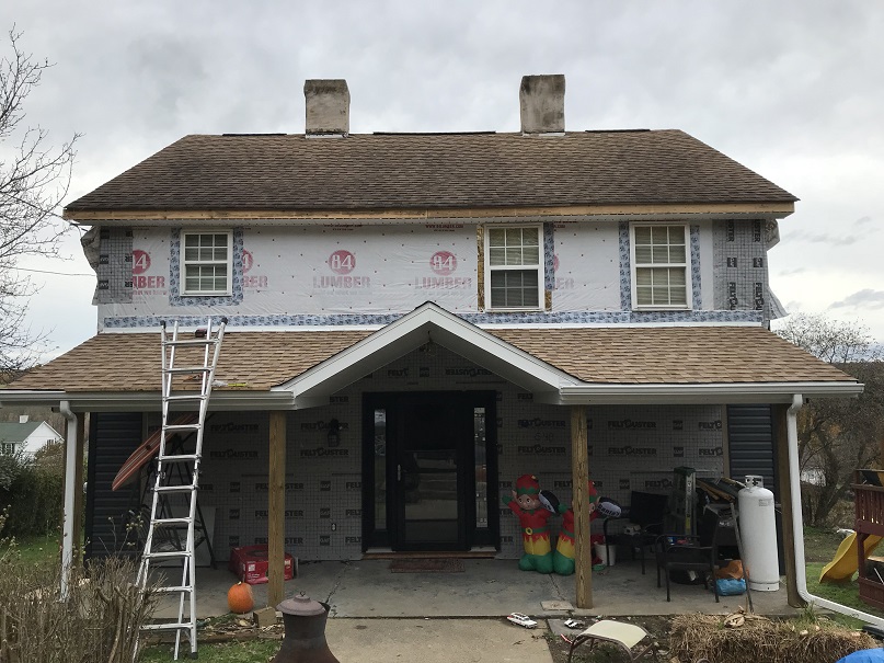 Porch roof remodel project with siding and wrap     